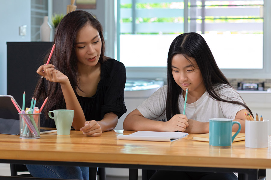 student and tutor together at a desk in Youngstown